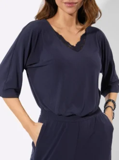 Jumpsuit mit Spitze am V-Ausschnitt